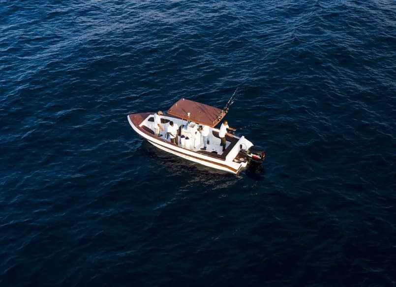 A fishing boat on deep blue water
