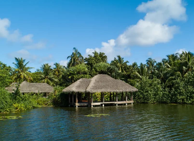 Thatched huts beside one of the island's freshwater lakes